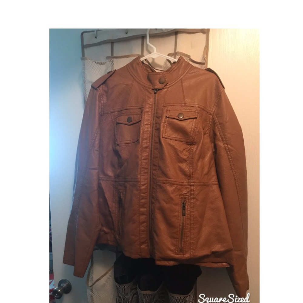 Woman’s tan jacket